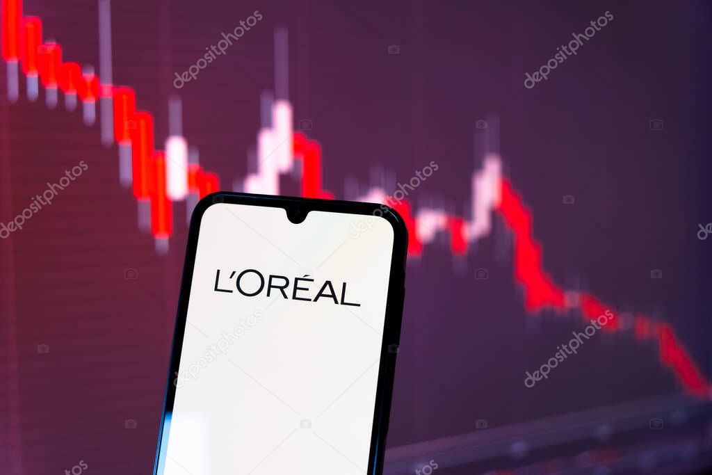 Prague, Czechia - 10 21 2024: Smartphone on surface showing L'Oreal logo.