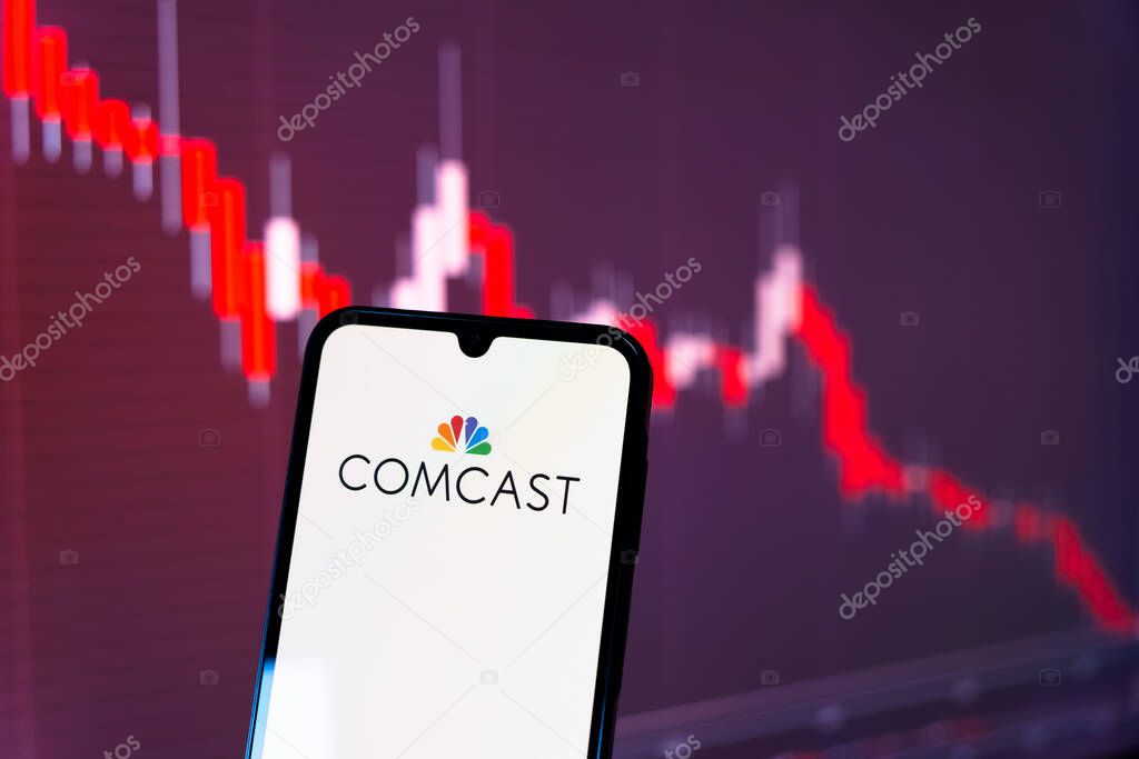 Prague, Czechia - 10 21 2024: Smartphone on surface showing Comcast logo.