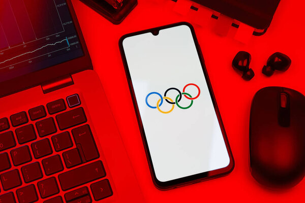Prague, Czechia - 10 21 2024: Smartphone on surface showing Olympics logo.