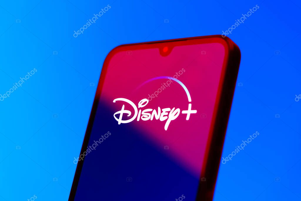 Prague, Czechia - 10 21 2024: Smartphone on surface showing Disney + logo.