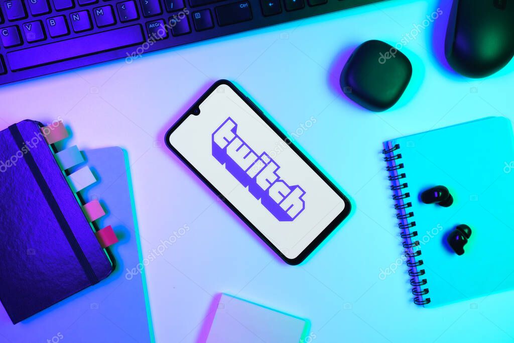 Prague, Czechia - 10 21 2024: Smartphone on surface showing Twitch logo.