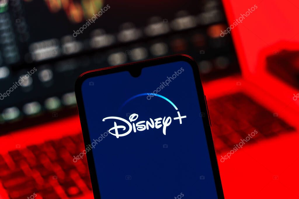 Prague, Czechia - 10 21 2024: Smartphone on surface showing Disney + logo.