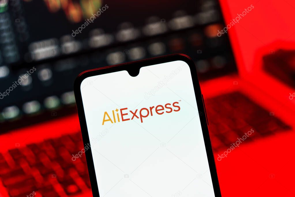Prague, Czechia - 10 21 2024: Smartphone on surface showing AliExpress logo.