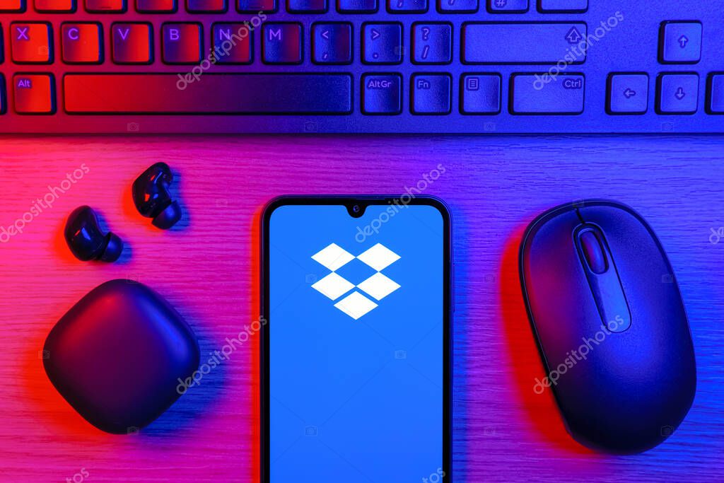 Prague, Czechia - 10 21 2024: Smartphone on surface showing Dropbox logo.