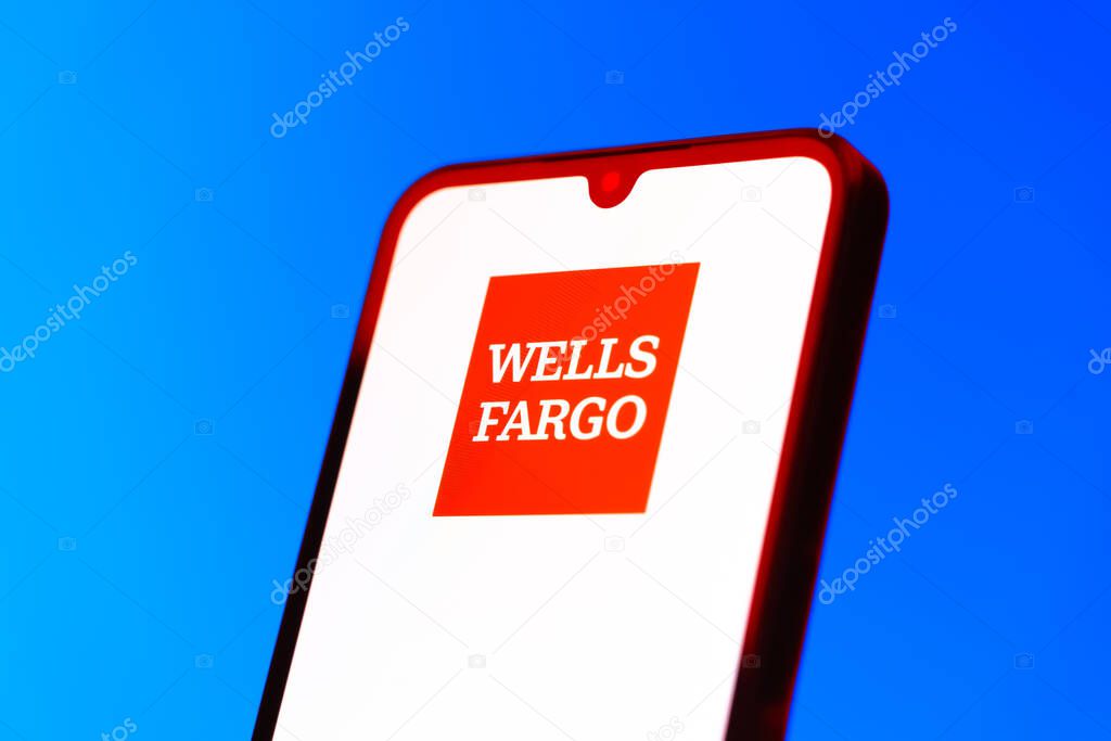 Prague, Czechia - 10 21 2024: Smartphone on surface showing Wells Fargo logo.
