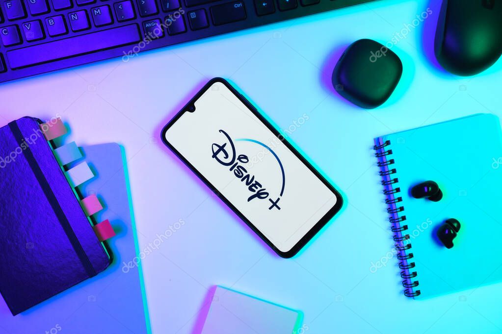 Prague, Czechia - 10 21 2024: Smartphone on surface showing Disney + logo.