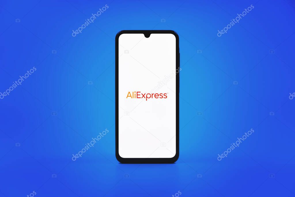Prague, Czechia - 10 21 2024: Smartphone on surface showing AliExpress logo.