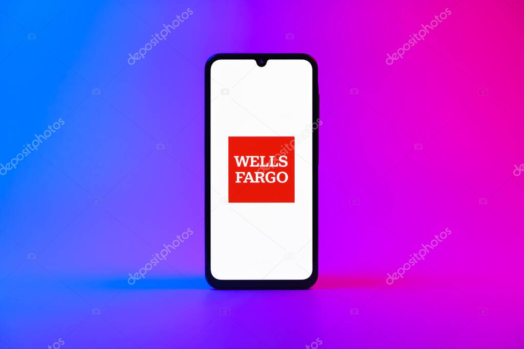 Prague, Czechia - 10 21 2024: Smartphone on surface showing Wells Fargo logo.