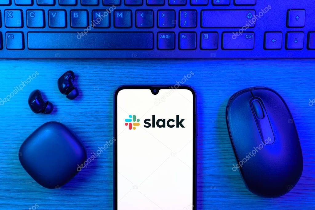 Prague, Czechia - 10 21 2024: Smartphone on surface showing Slack logo.