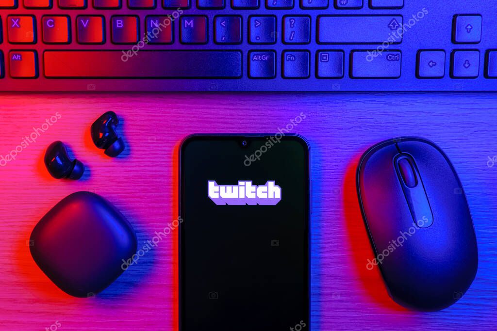 Prague, Czechia - 10 21 2024: Smartphone on surface showing Twitch logo.