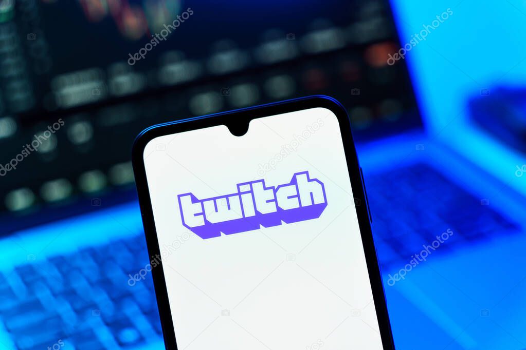 Prague, Czechia - 10 21 2024: Smartphone on surface showing Twitch logo.