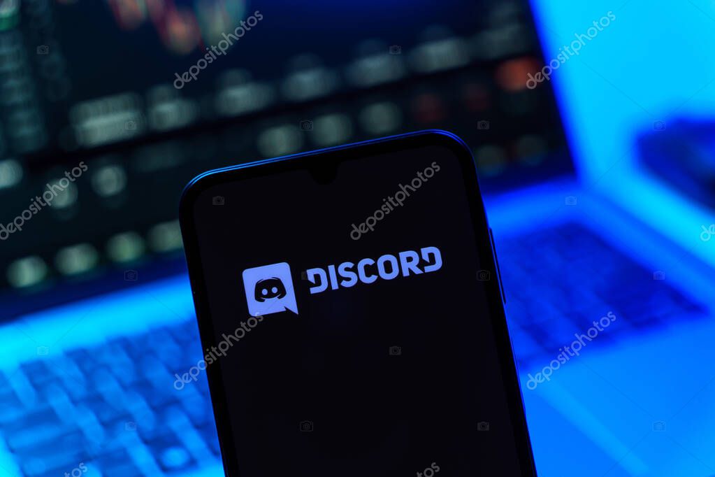 Prague, Czechia - 10 21 2024: Smartphone on surface showing Discord logo.