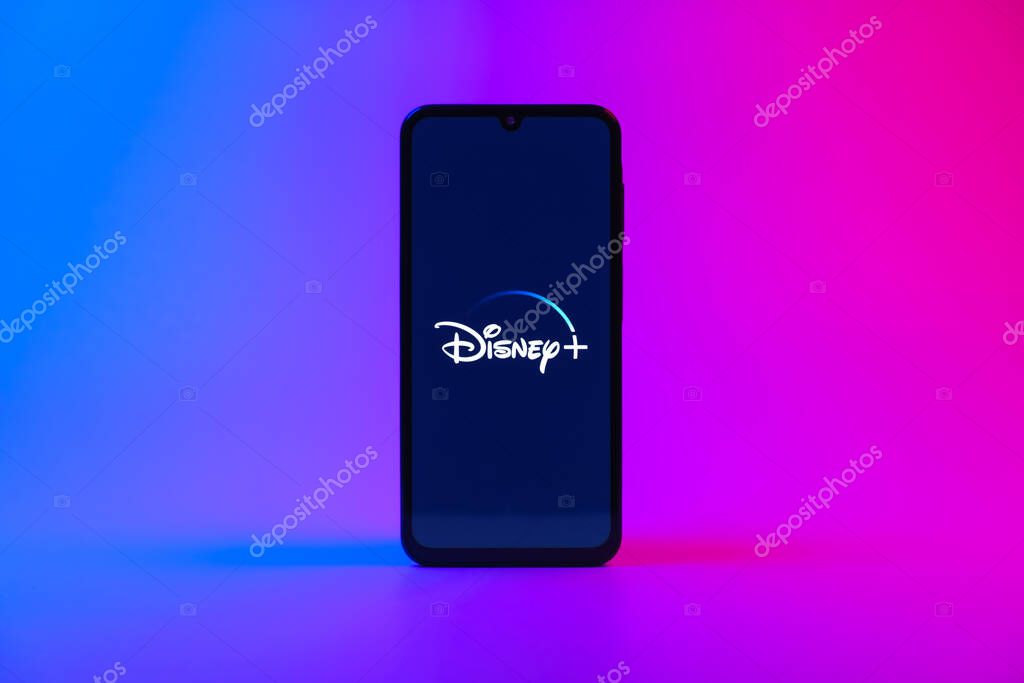 Prague, Czechia - 10 21 2024: Smartphone on surface showing Disney + logo.