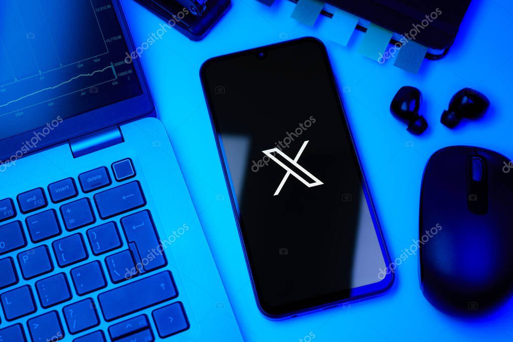 Prague, Czechia - 8 20 2024: Smartphone on surface showing social network X logo.