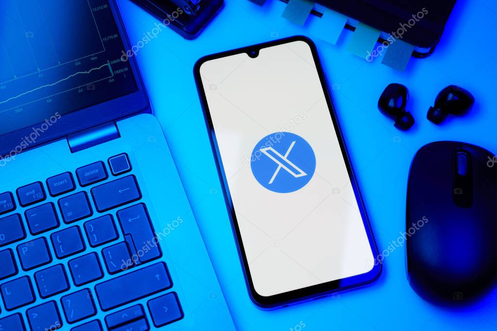 Prague, Czechia - 8 20 2024: Smartphone on surface showing social network X logo.