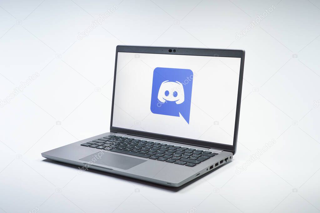 Prague, Czechia - 02 21 2025: Laptop on surface showing Discord logo.