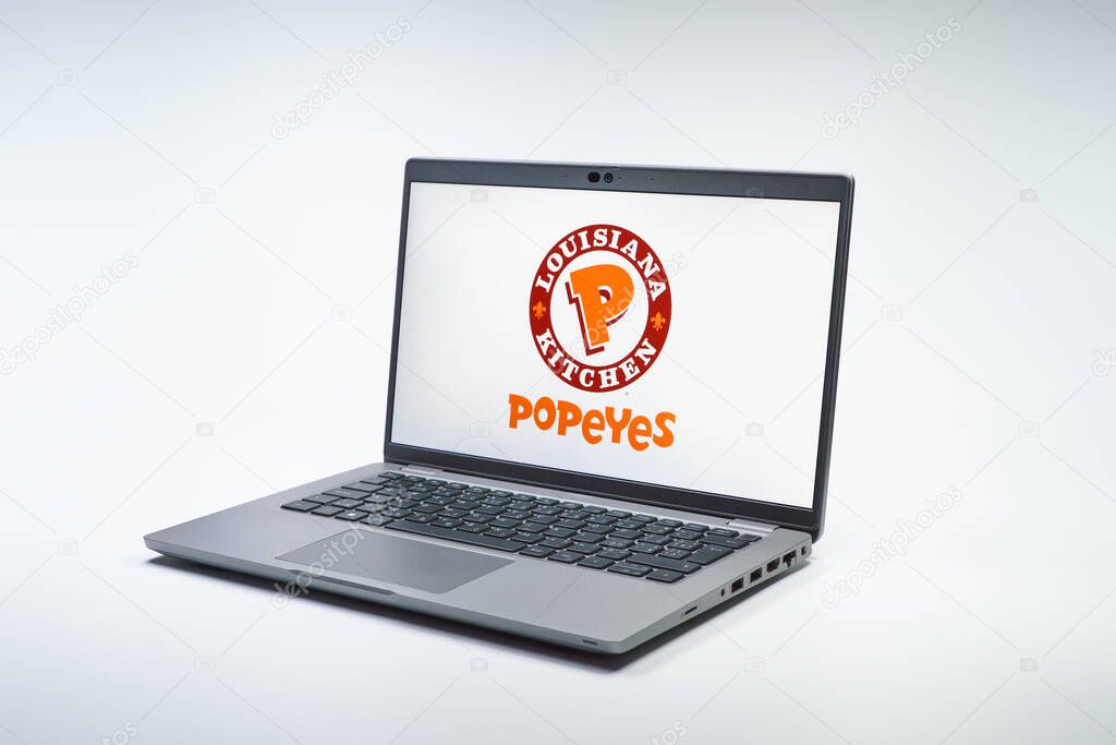 Prague, Czechia - 02 21 2025: Laptop on surface showing Popeyes logo.