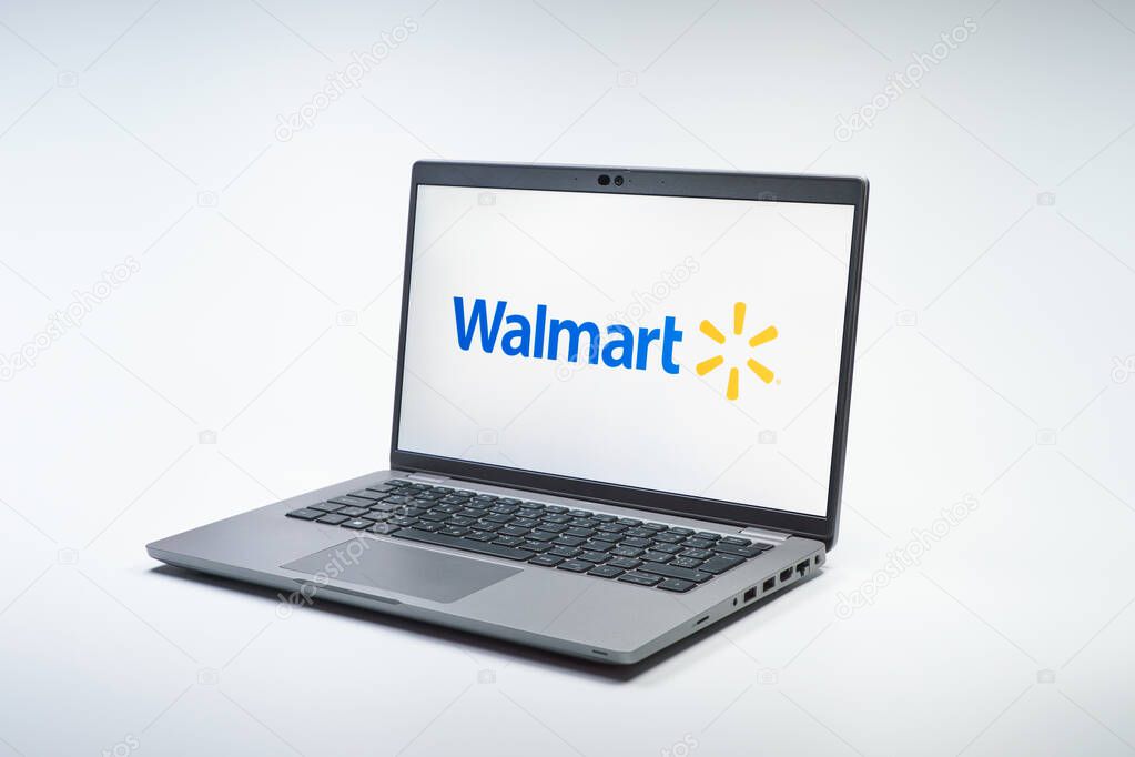 Prague, Czechia - 02 21 2025: Laptop on surface showing Walmart logo.
