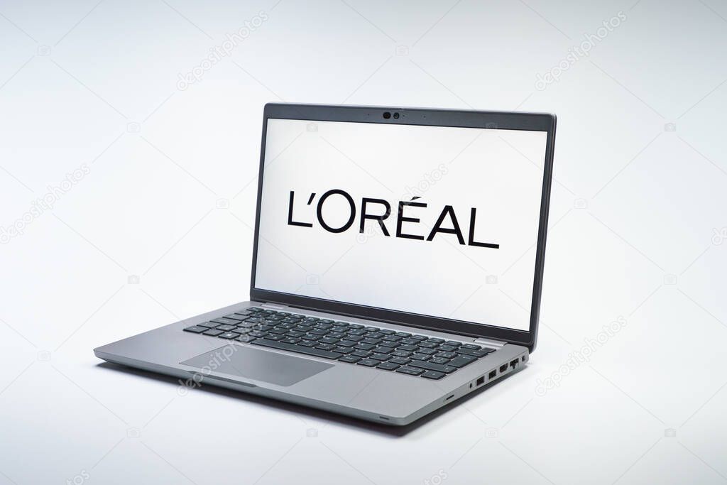 Prague, Czechia - 02 21 2025: Laptop on surface showing L'Oreal logo.