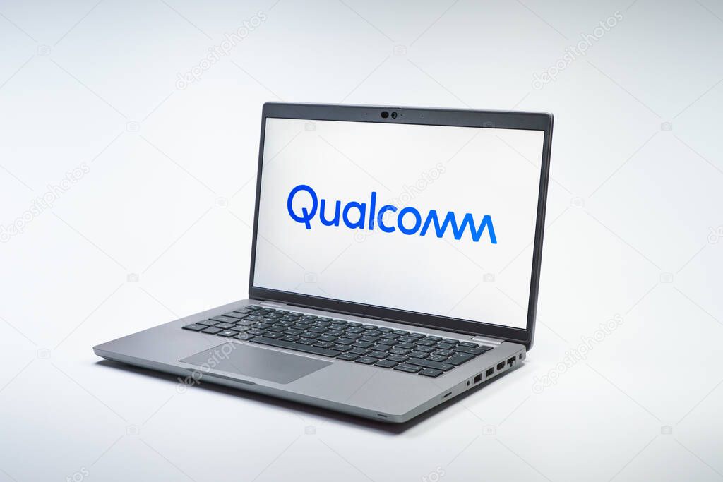 Prague, Czechia - 02 21 2025: Laptop on surface showing Qualcomm logo.