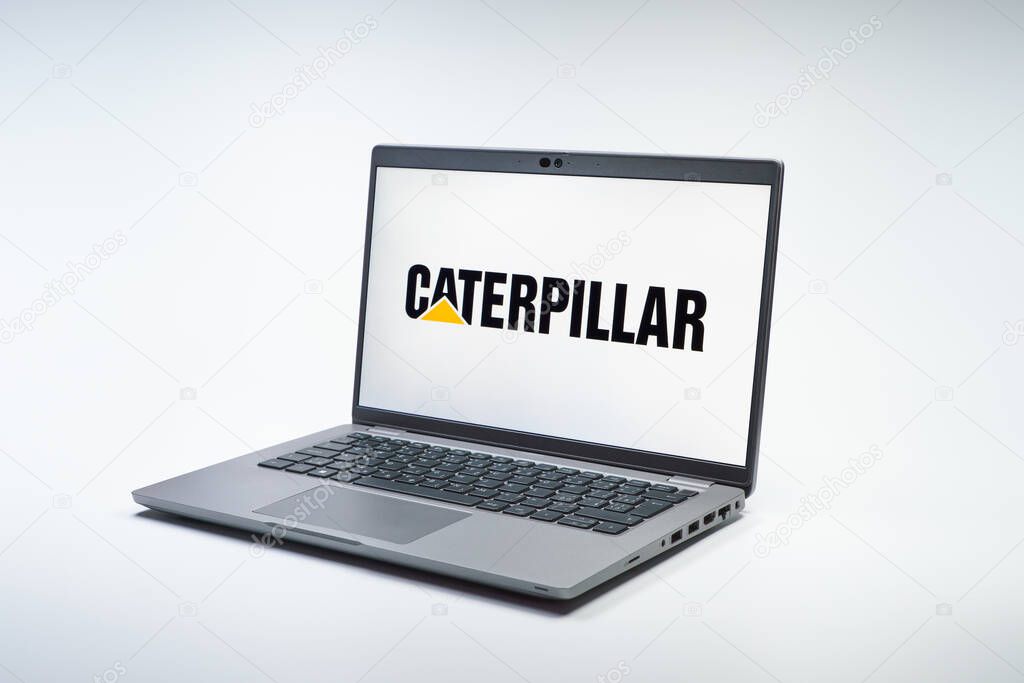 Prague, Czechia - 02 21 2025: Laptop on surface showing Caterpillar logo.