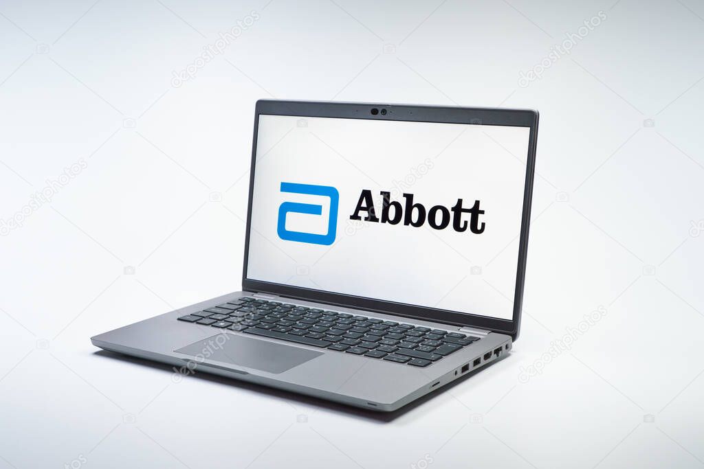 Prague, Czechia - 02 21 2025: Laptop on surface showing Abbott Laboratories logo.
