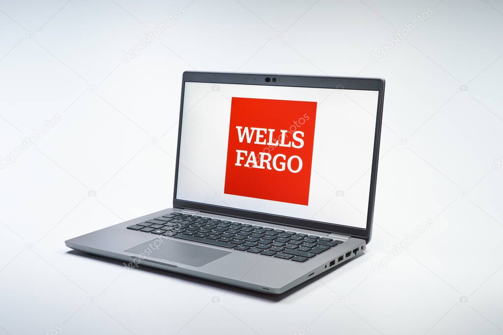 Prague, Czechia - 02 21 2025: Laptop on surface showing Wells Fargo logo.