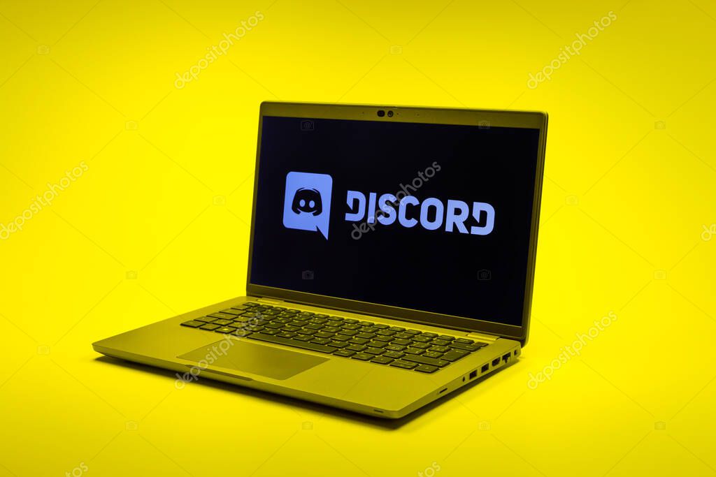 Prague, Czechia - 02 21 2025: Laptop on surface showing Discord logo.