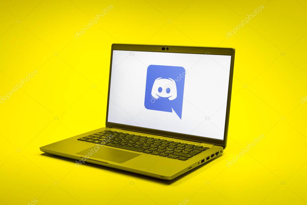 Prague, Czechia - 02 21 2025: Laptop on surface showing Discord logo.