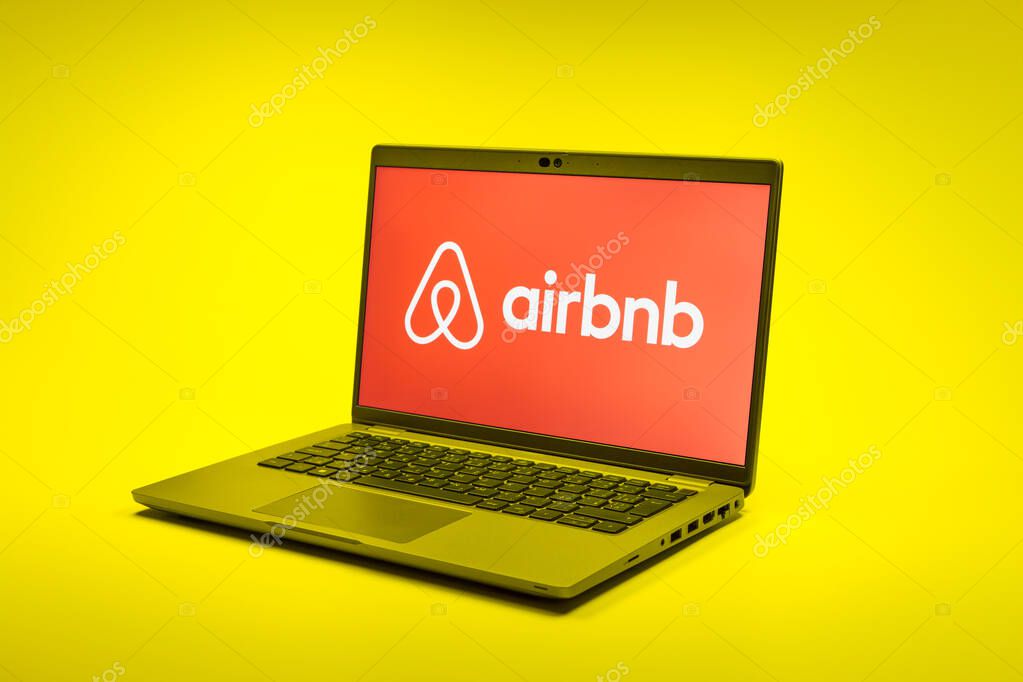 Prague, Czechia - 02 21 2025: Laptop on surface showing Airbnb logo.