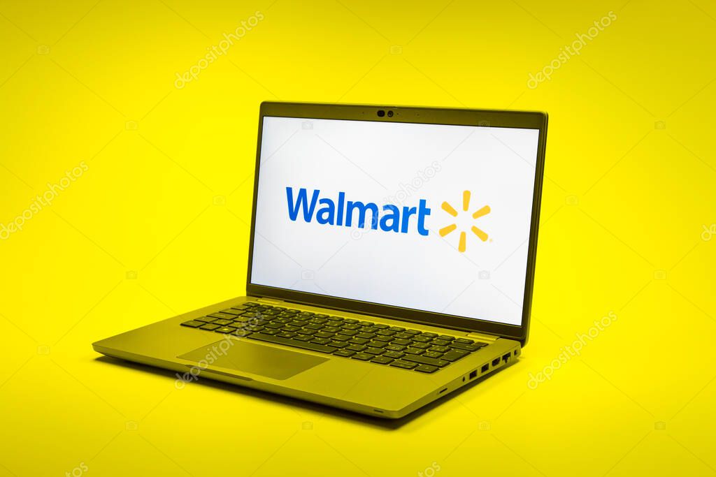 Prague, Czechia - 02 21 2025: Laptop on surface showing Walmart logo.