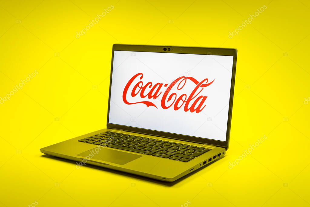 Prague, Czechia - 02 21 2025: Laptop on surface showing Coca-Cola logo.