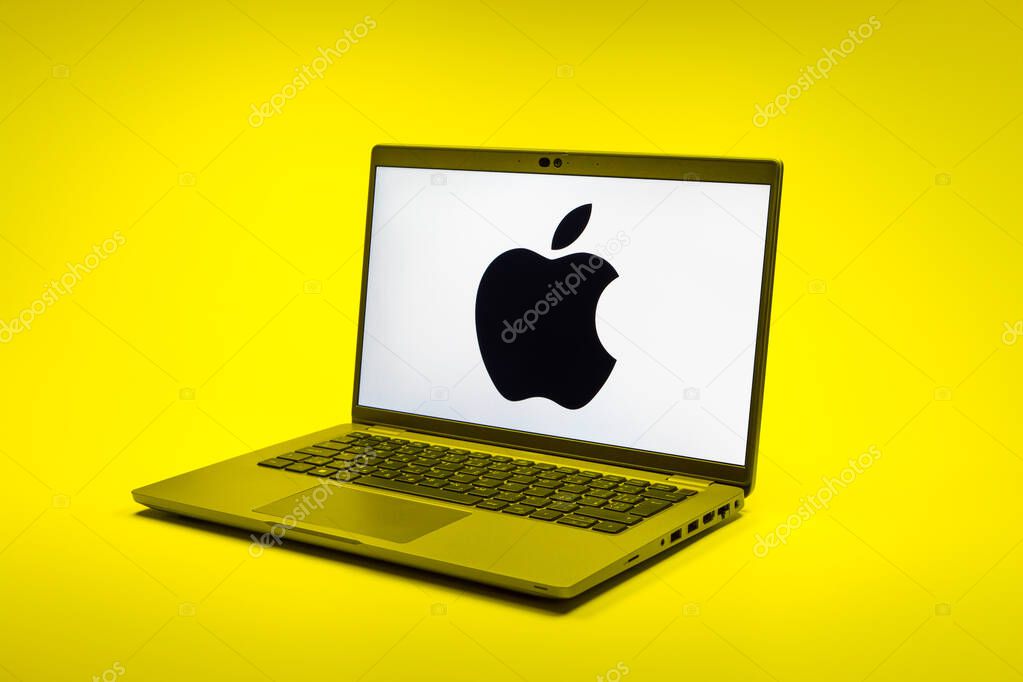 Prague, Czechia - 02 21 2025: Laptop on surface showing Apple logo.