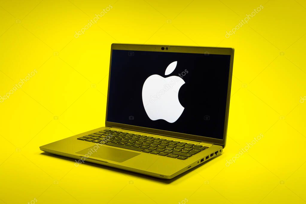 Prague, Czechia - 02 21 2025: Laptop on surface showing Apple logo.