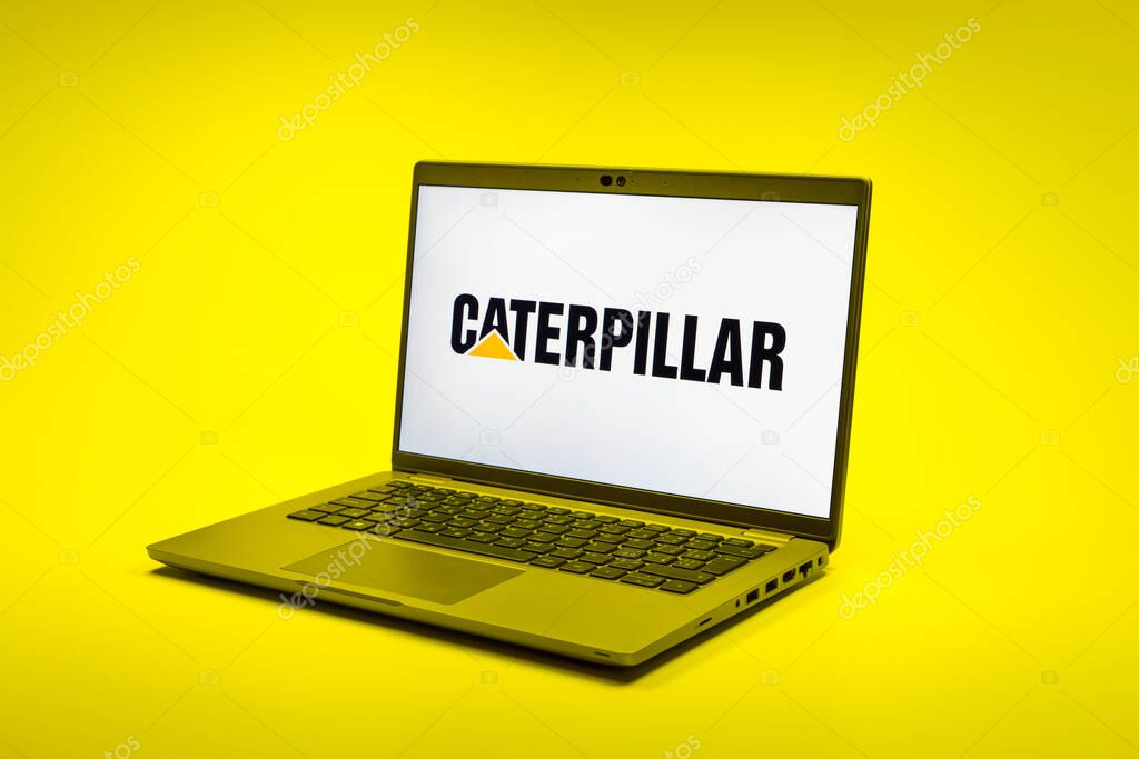 Prague, Czechia - 02 21 2025: Laptop on surface showing Caterpillar logo.