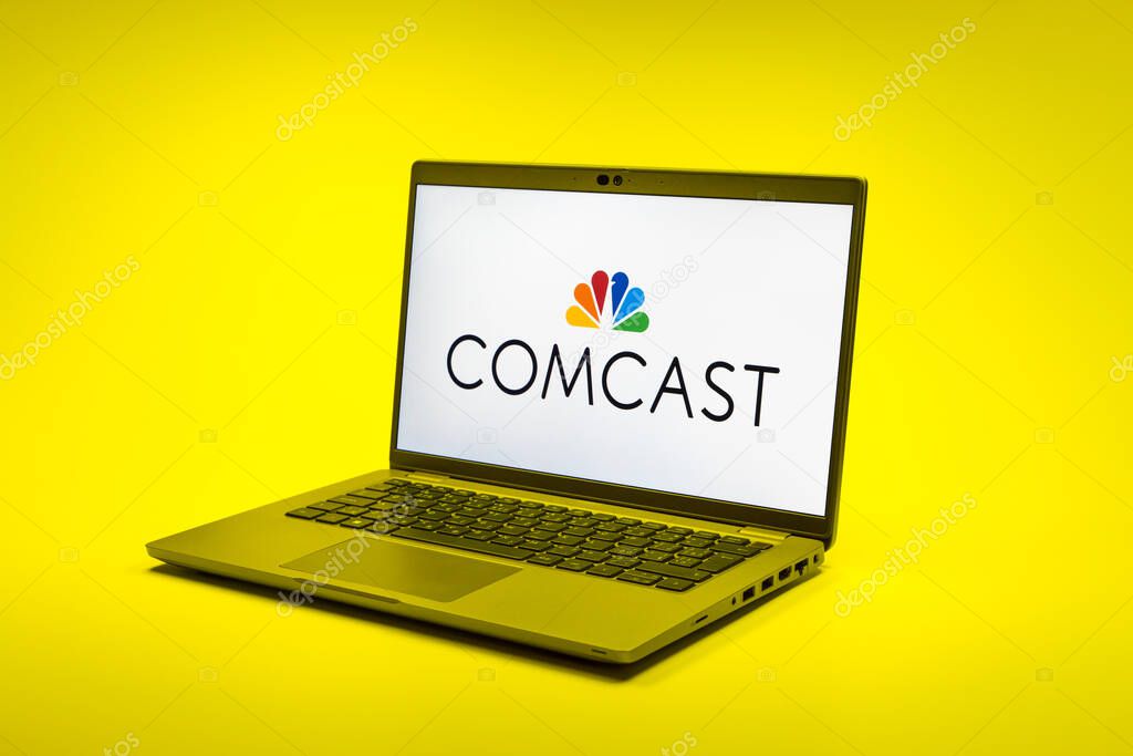 Prague, Czechia - 02 21 2025: Laptop on surface showing Comcast logo.