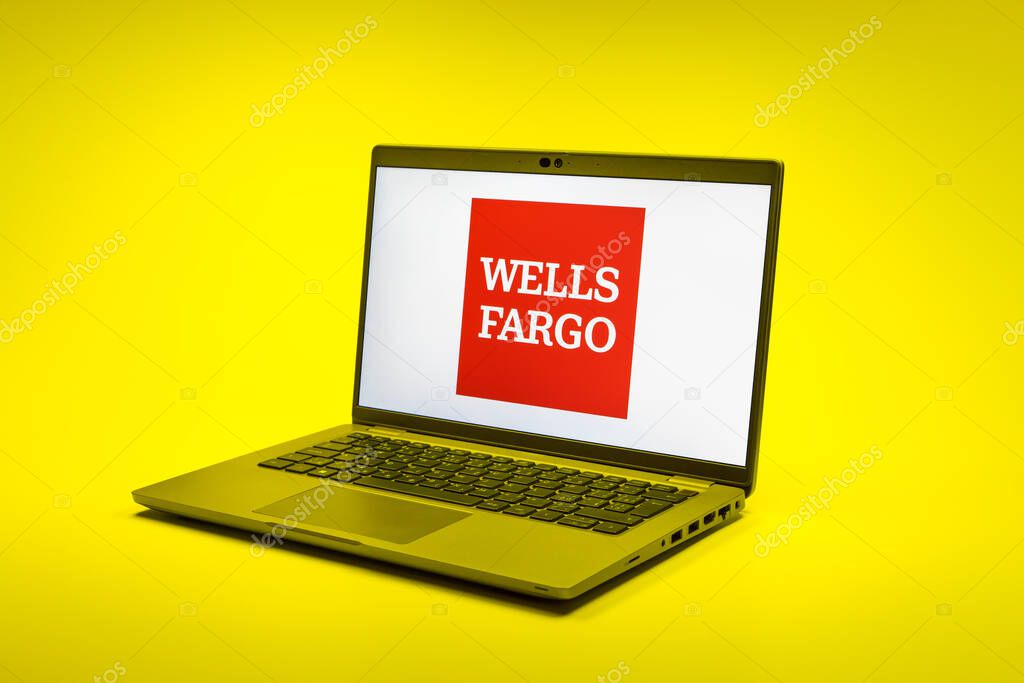 Prague, Czechia - 02 21 2025: Laptop on surface showing Wells Fargo logo.