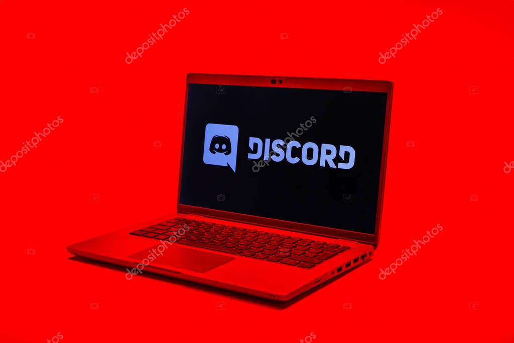 Prague, Czechia - 02 21 2025: Laptop on surface showing Discord logo.