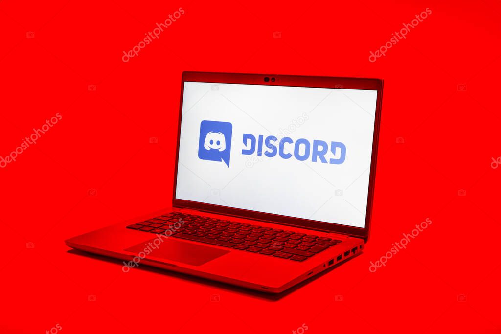 Prague, Czechia - 02 21 2025: Laptop on surface showing Discord logo.