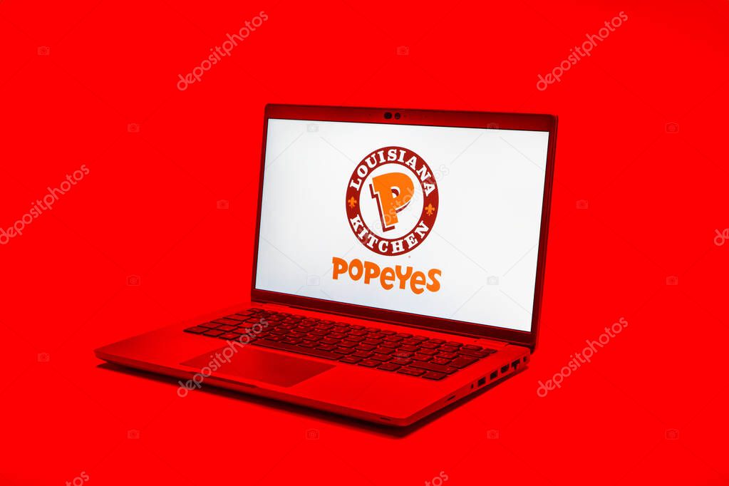 Prague, Czechia - 02 21 2025: Laptop on surface showing Popeyes logo.