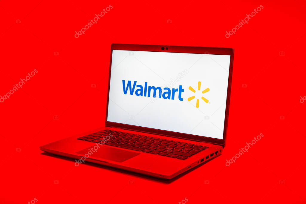 Prague, Czechia - 02 21 2025: Laptop on surface showing Walmart logo.