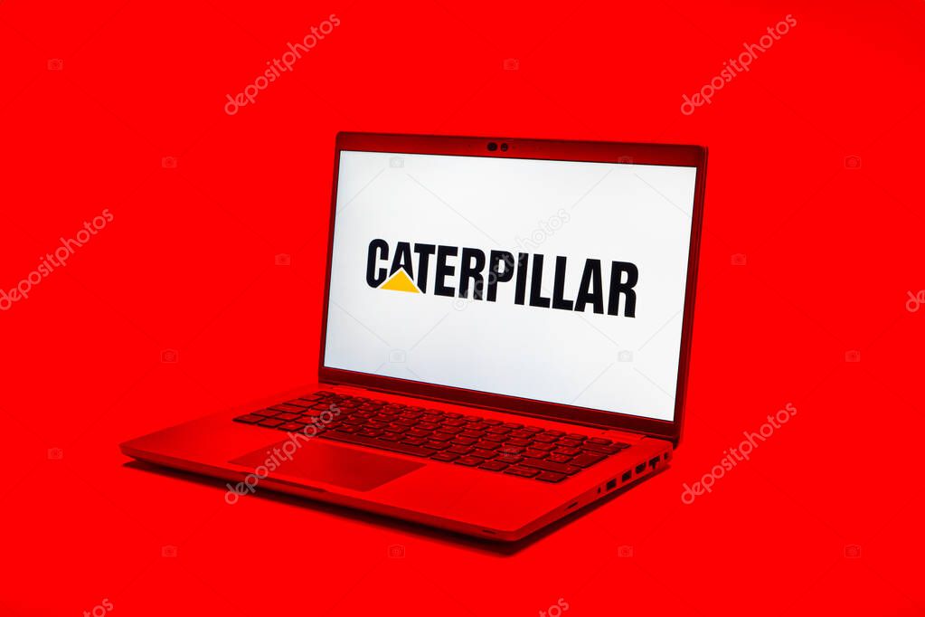 Prague, Czechia - 02 21 2025: Laptop on surface showing Caterpillar logo.