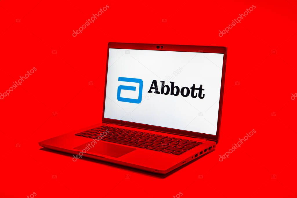 Prague, Czechia - 02 21 2025: Laptop on surface showing Abbott Laboratories logo.