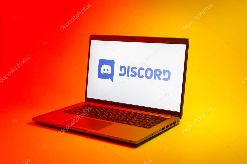 Prague, Czechia - 02 21 2025: Laptop on surface showing Discord logo.