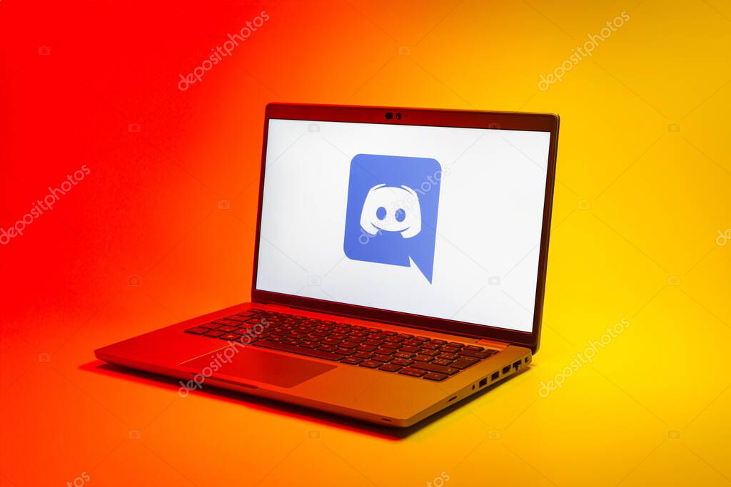 Prague, Czechia - 02 21 2025: Laptop on surface showing Discord logo.