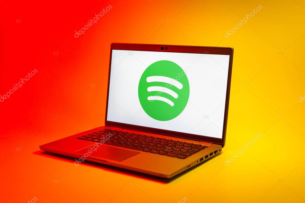 Prague, Czechia - 02 21 2025: Laptop on surface showing Spotify logo.