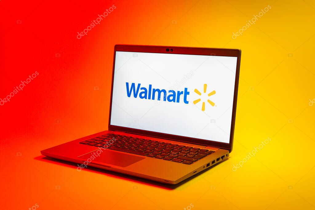 Prague, Czechia - 02 21 2025: Laptop on surface showing Walmart logo.