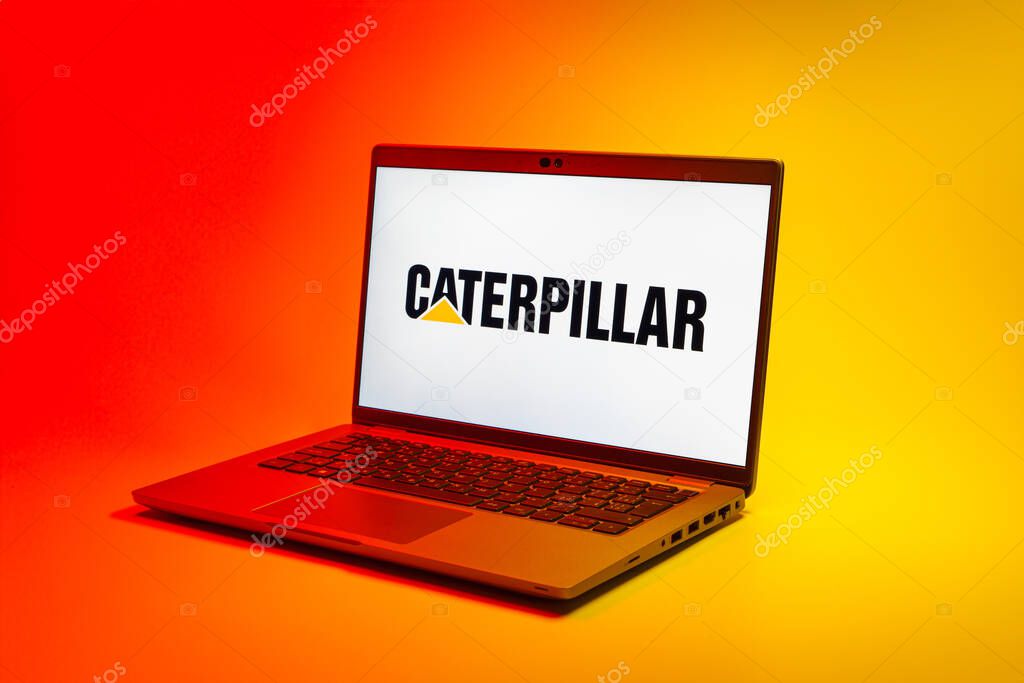 Prague, Czechia - 02 21 2025: Laptop on surface showing Caterpillar logo.