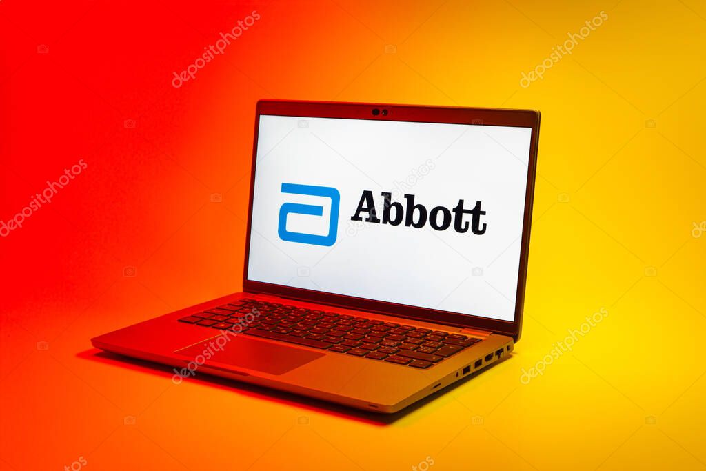 Prague, Czechia - 02 21 2025: Laptop on surface showing Abbott Laboratories logo.