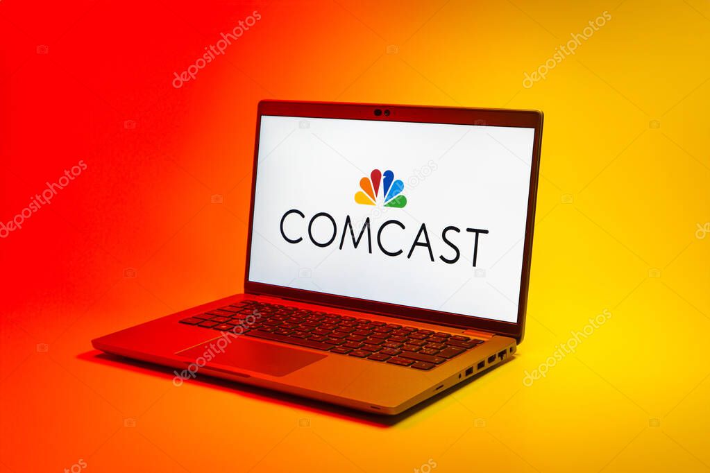 Prague, Czechia - 02 21 2025: Laptop on surface showing Comcast logo.